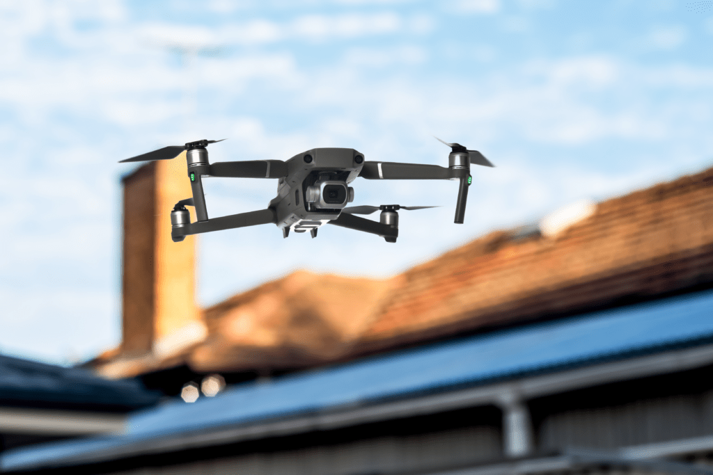 drone-with-blurred-house-roof-behind