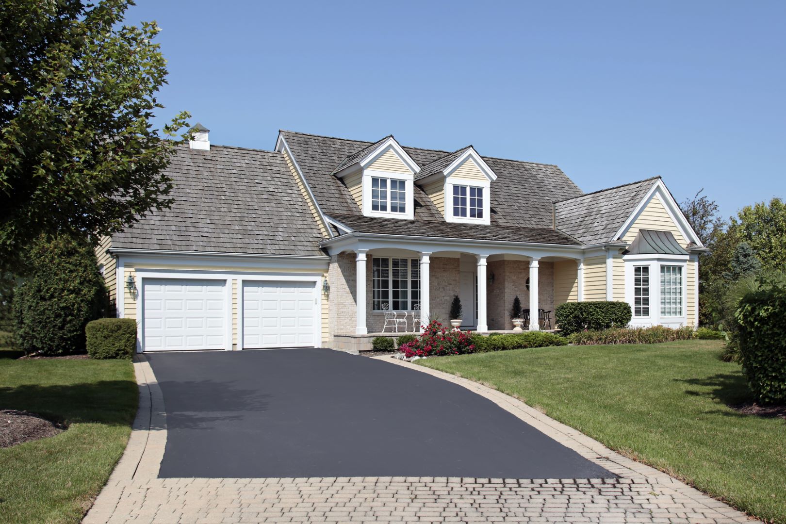 driveway-up-to-residential-home-two-car-garage